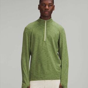 Green surge warm half zip from Lulelmon. Rulu fabric. Good as new. Worn once.